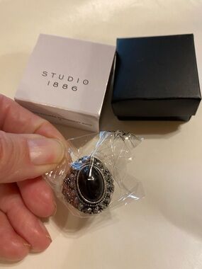 Avon $10-Studio Black Oval Stone Silver-Tone Filigree Ring